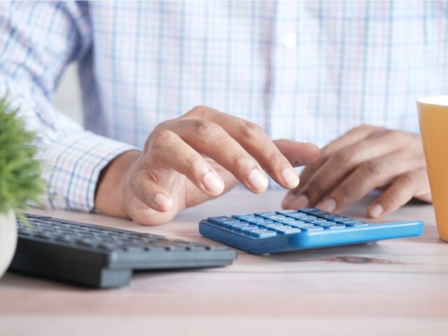 Auditor calculating millages